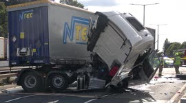 Lorry collides with car and overhead gantry in New Malden, London.