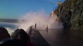 Locals Soaked By Surprise As Massive Wave Crashes Into The Breakwater