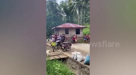 Helpful neighbours carry family's home to new location in the Philippines