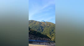 Paraglider pilot crash lands on beach in eastern China