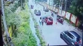 Man slips and falls into roadside drain in northern India, rescued