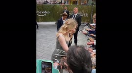 Morfydd Clark signing autographs at the The Lord of the Rings: The Rings of Power premiere in London, UK