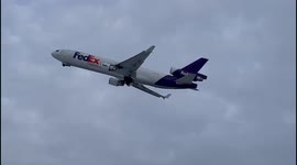 Fedex MD-11 Freighter Plane take off at snowy Anchorage Ted Stevens Airport