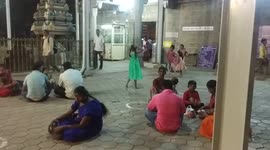 Small girls are playing inside of a temple area