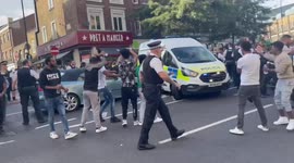 Clashes with police as protesters try to force their way towards the Eritrean Embassy in London