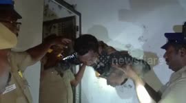 Police catch two men drinking liquor at shop after drilling hole into wall in southern India