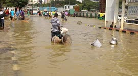 People travel on tractors and motorbikes despite floods in India's IT capital