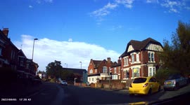 DASHCAM - Impatient drivers mount pavement and drive several yards along it to get past.