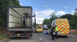 ADDITIONAL FOOTAGE - Animal Rebellion protesters spark chaos by supergluing themselves to lorries at Muller dairy