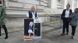 Artist displays satirical painting of Liz Truss before she arrives to give first speech as Prime Minister