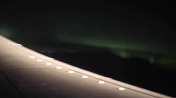 Passenger records northern lights from plane in Alaska