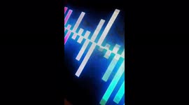 ASMR moving lights in blues purples shaped in blocks with a black background