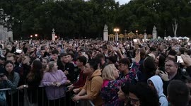 A rather crazy man tries to disrupt the crowd outside of Buckingham Palace shouting all sorts of things and getting on people's neveres. earlier he had been claiming he was related to the Royal Family