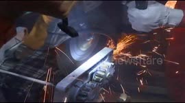 Firemen save woman's hand trapped in noodle machine