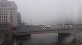 Thick fog over Tower Bridge and The Shard