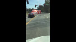 Light aircraft parachutes onto road in emergency landing