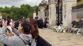 Selfies and flowers outside Buckingham Palace gates after Queen’s death