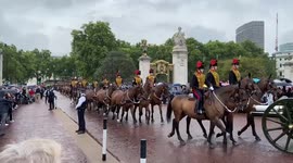 King’s Troop Royal Horse Artillery pass by Buckingham Palace in tribute to the Queen