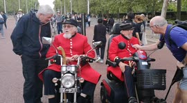 Chelsea Pensioners depart Buckingham Palace after paying their respects