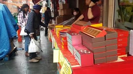 Shoppers in London's Chinatown stock up on mooncakes ahead of the Mid-Autumn Festival