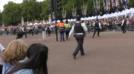 Watch moment police rush to tackle man who jumped barrier in front of King Charles' convoy