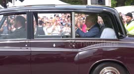 Charles waves to cheering crowds after he’s officially declared King