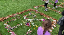 Queens floral tribute green park- queen initials laid out with flowers