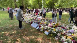Queens floral tribute green park- a wall of flowers are laid by the public