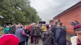 Volunteers hand out food to residents of newly liberated Balakliya, Ukraine