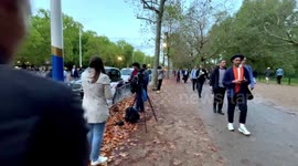 Young Man Seen Bringing Flowers To Buckingham Palace After The Untimely Death Of Queen Elizabeth II