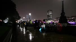 People late into the night queue in the pouring rain in the hope of being amount the first to see the Queen at Westminster Hall