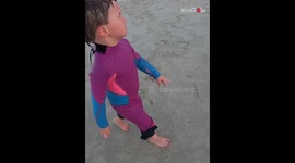 Little surfer straight-up refuses to go home in order to catch more waves