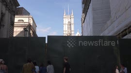 Well-wishers BLOCKED off by huge metal Berlin Wall-style security barriers at Westminster Abbey