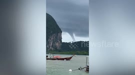 Sight-seeing tourists greeted by large waterspout rampaging by Thai islands