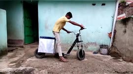 A Young boy prepared a motorcycle by juggling the items of junk in Northern India