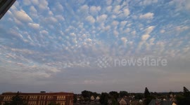 Puffy Clouds Over City