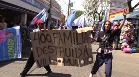 Activists protest in Carapicuíba during a political campaign for governor