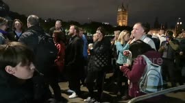 Kind people giving out drinks near the end of the Lying in state queue by Lambeth Palace