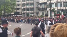 Huge crowds gathered in London surge past police in attempt to get glimpse of Queen's funeral procession
