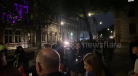 Mourners and media gather before sunrise on Parliament Street for Queen’s funeral