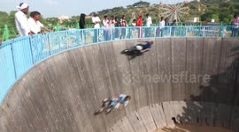 Bikers perform daredevil stunts in India's Well of Death