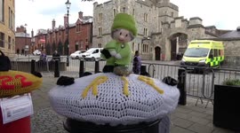 An unusual knitted tribute to the Queen on top of a post box in Windsor