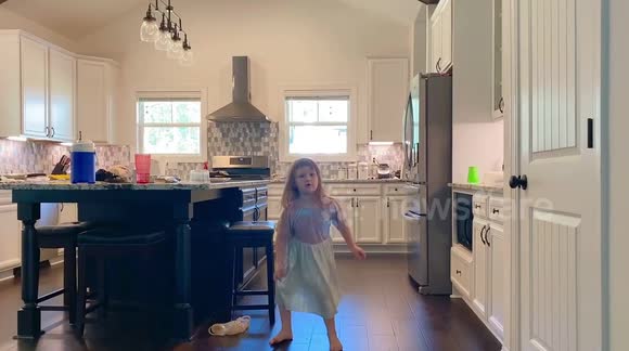 Cute youngster shows how to hula loop.