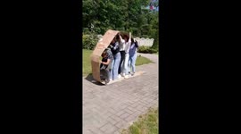 College friends make a fun-looking cardboard tank for sports week