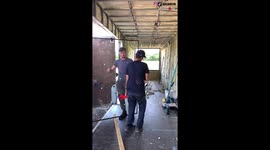 'Oops!' Men shocked as large glass sheet shatters out of the blue