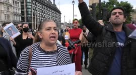 Iranian men and women shave their heads in protest against the Iranian Government next to the Churchill Statue