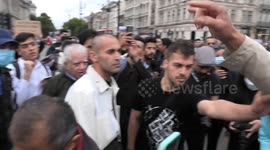 Iranians in the UK burn a hijab in front of Parliament in protest for Mahsa Aminifor