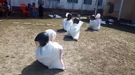 Students bounce across field in hilarious gunny sack race in Myanmar
