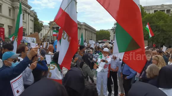 Iranian royalists hold up picture of last Shah of Iran, at protest for Mahsa Amini in London's Trafalgar Square