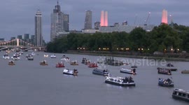 Crowds line the Thames to watch flotilla of 150 boats sail down the river as a tribute to the Queen